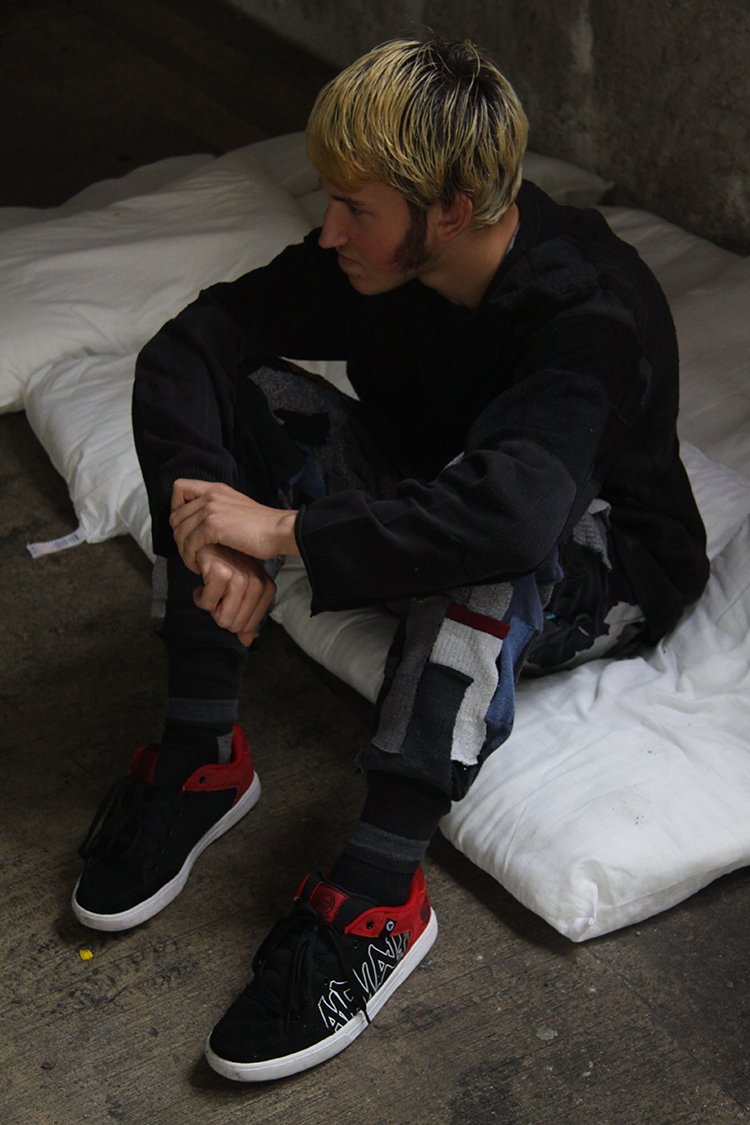 Model wearing Tracey Dockree's upcycled "Urban Decay" jumper and lounge pants on a photoshoot
