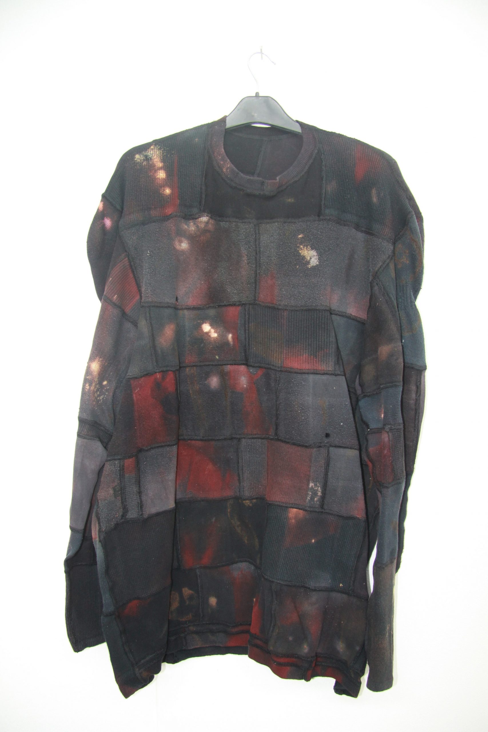 Tracey Dockree upcycled jumper hanging on a wall