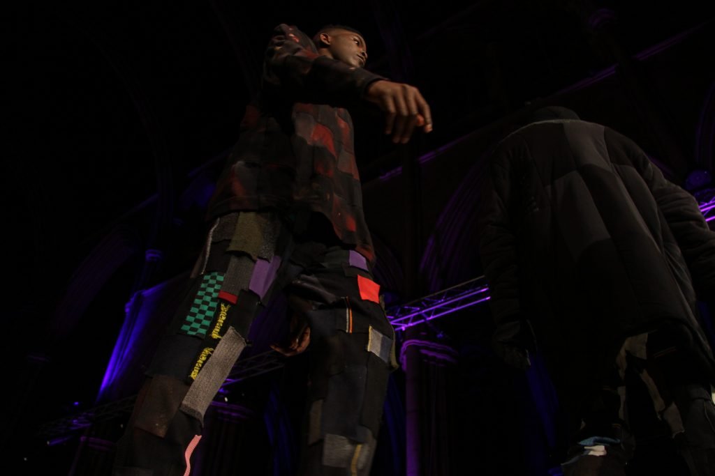 Model wearing Tracey Dockree' s "Rust" jumper and upcycled loungepants on the catwalk at Brighton Fashion Week 2015