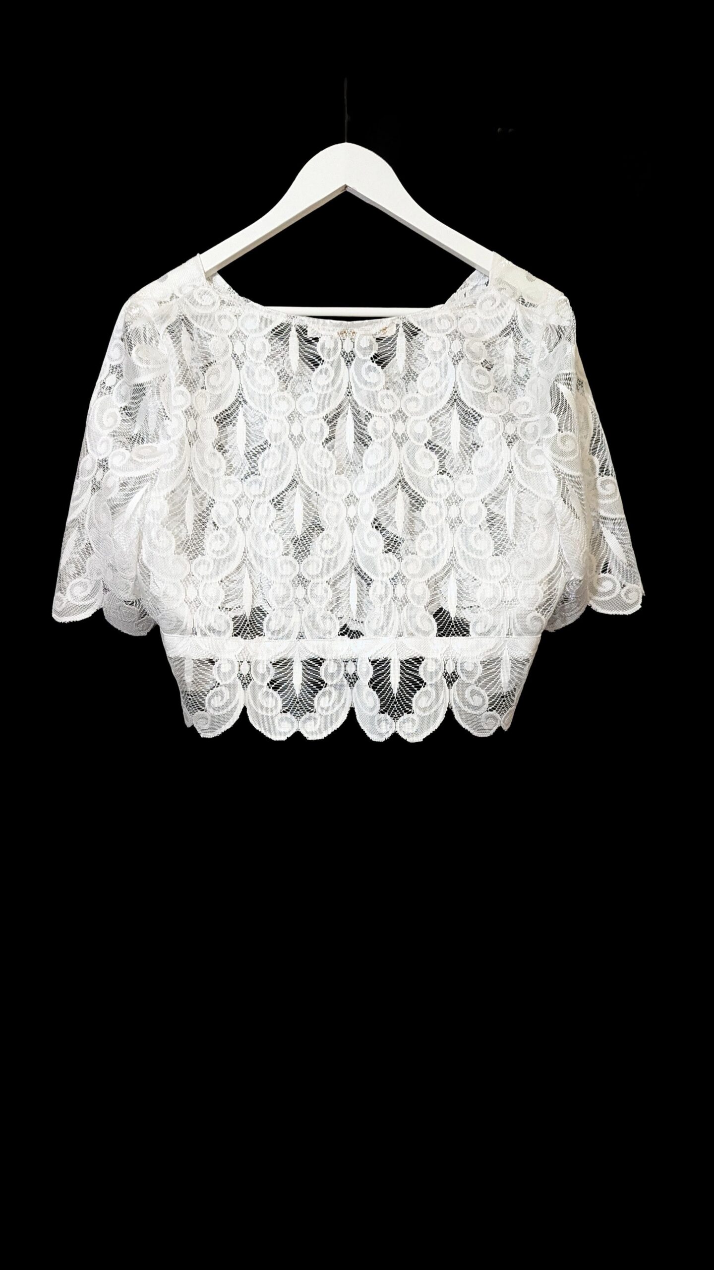 Back of white peacock feather lace top